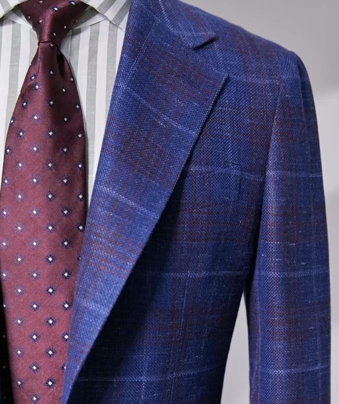 Close-up of a bespoke jacket lapel and tie detail